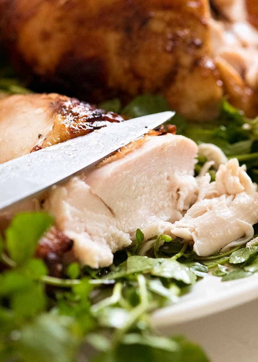 Close up showing how juicy chicken breast is when chicken is brined