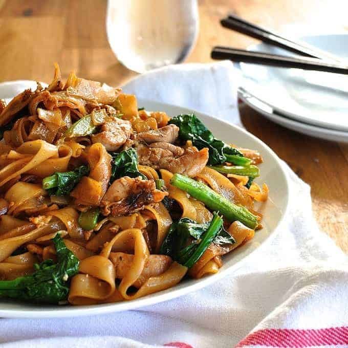 Pad See Ew, Thai stir fried noodles, a very popular Thai Street food, with chicken and Chinese Broccoli (kai-lan). On the table in 15 minutes.