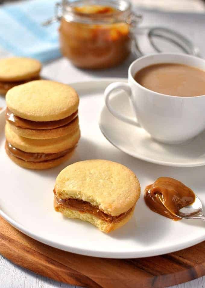 Shortbread Cookie Sandwiches with Dulce de Leche with bite taken out