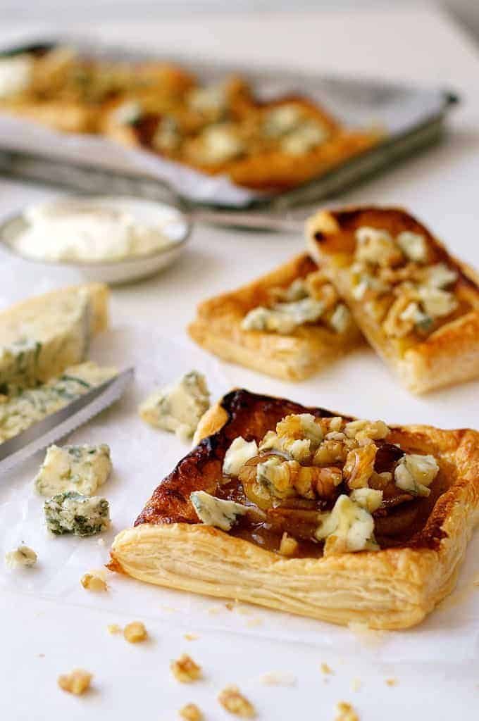 Caramelized Pear and Blue Cheese Tarts with crumbled cheese and walnuts