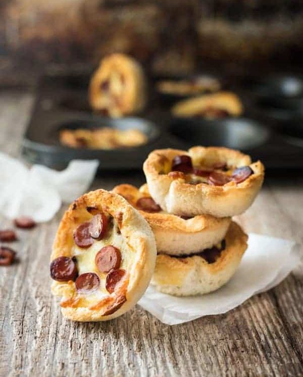 Garlic Bread Mini Pizza - made from plain sandwich bread brushed with garlic butter, these mini pizzas taste like a cross between garlic bread and pizza!