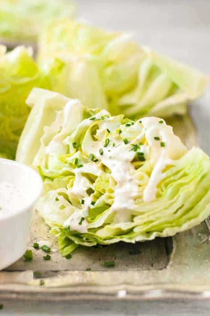 Closeup of Lettuce Wedge Salad with Ranch Dressing