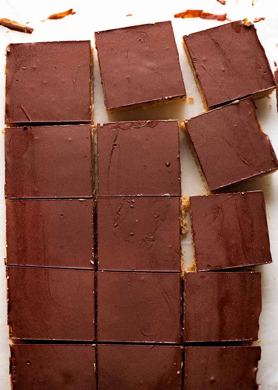 Overhead photo of Caramel Slice cut into pieces showing the chocolate didn't crack