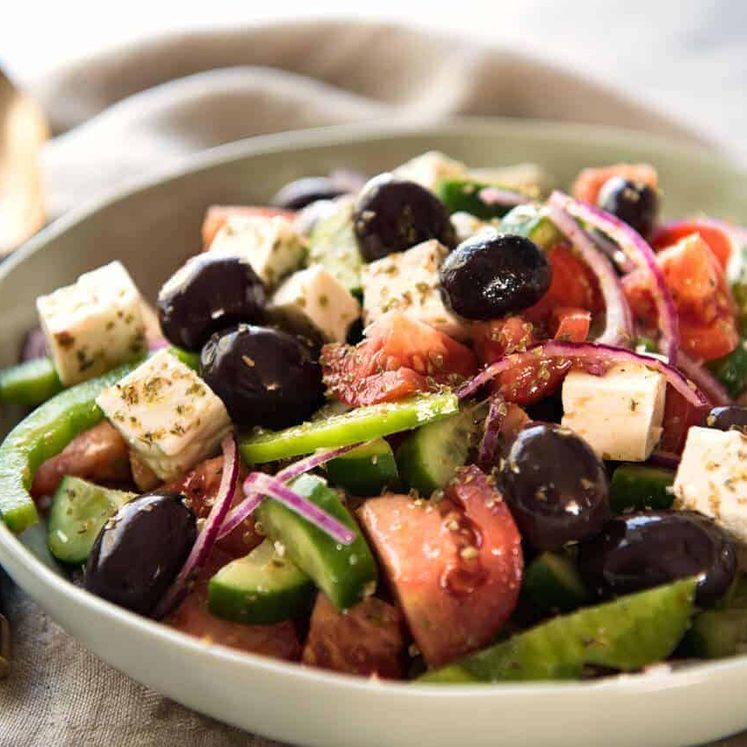 A classic Greek Salad with plump olives and a beautiful homemade Greek Salad Dressing. www.recipetineats.com