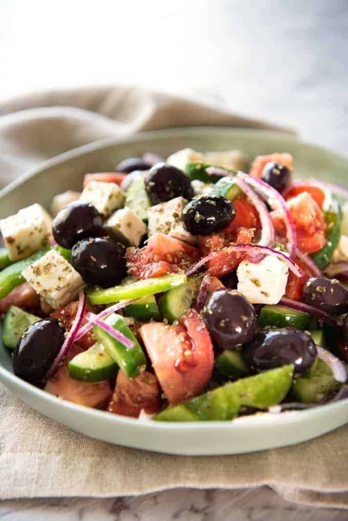 A classic Greek Salad with plump olives and a beautiful homemade Greek Salad Dressing. recipetineats.com