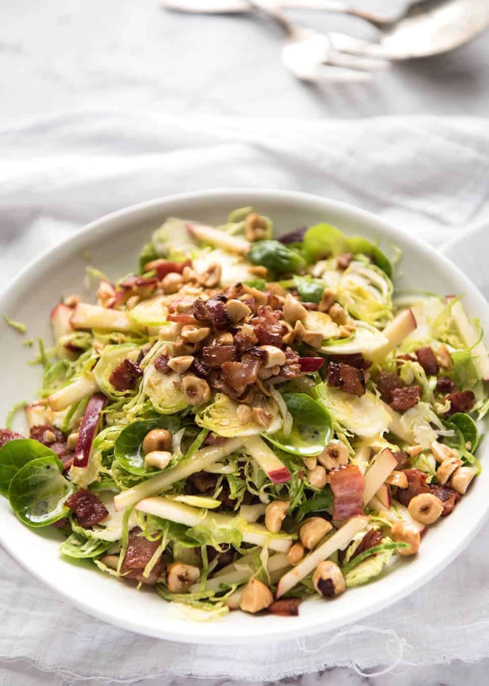 Brussel Sprout Salad - the combination of brussels sprouts, bacon, apple and hazelnuts is a magical combination! recipetineats.com