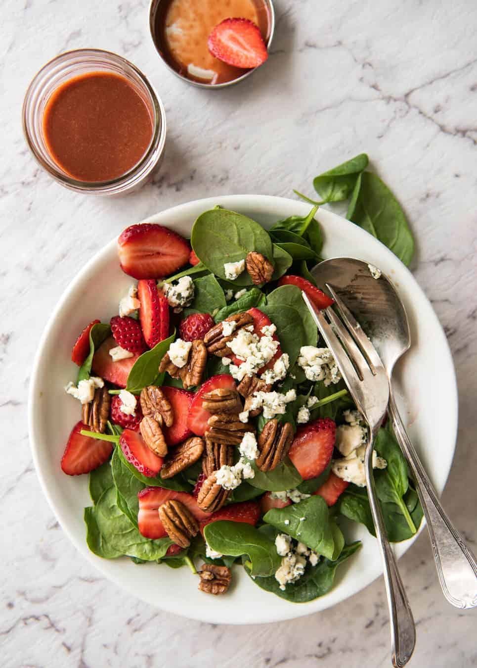 A stunning Chef recipe for a Strawberry Spinach Salad. Spinach, fresh strawberries, blue cheese and candied pecans with a Strawberry Balsamic Dressing. recipetineats.com