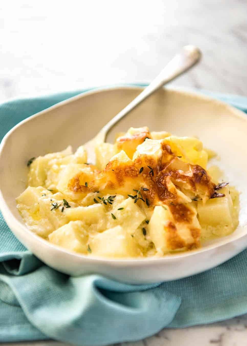 A faster, cheesier, creamier alternative to Scalloped Potatoes / Potato Gratin, this Easy Creamy Cheesy Potato Bake is made with cubed potatoes cooked in a cream and cheese sauce. www.recipetineats.com