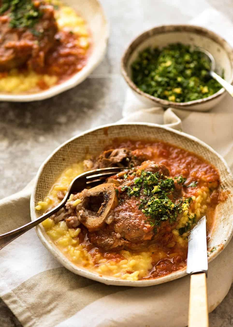 Fork tender veal braised in a rich red sauce, Osso Buco is a meal fit for a king! www.recipetineats.com