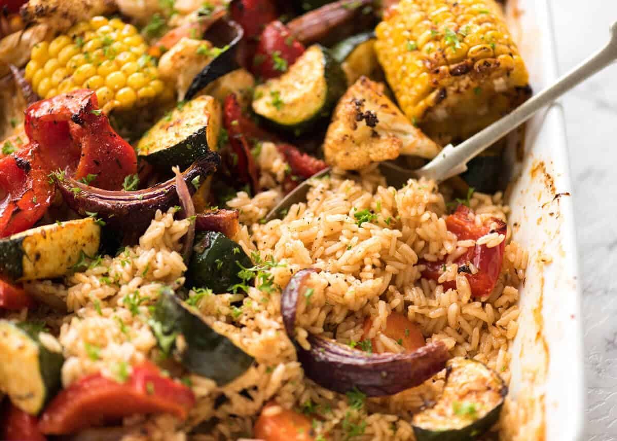Oven Baked Rice and Vegetables - Fluffy seasoned rice and oven roasted vegetables, all made in ONE pan! Fabulous meal or side, super quick and easy to prep. recipetineats.com