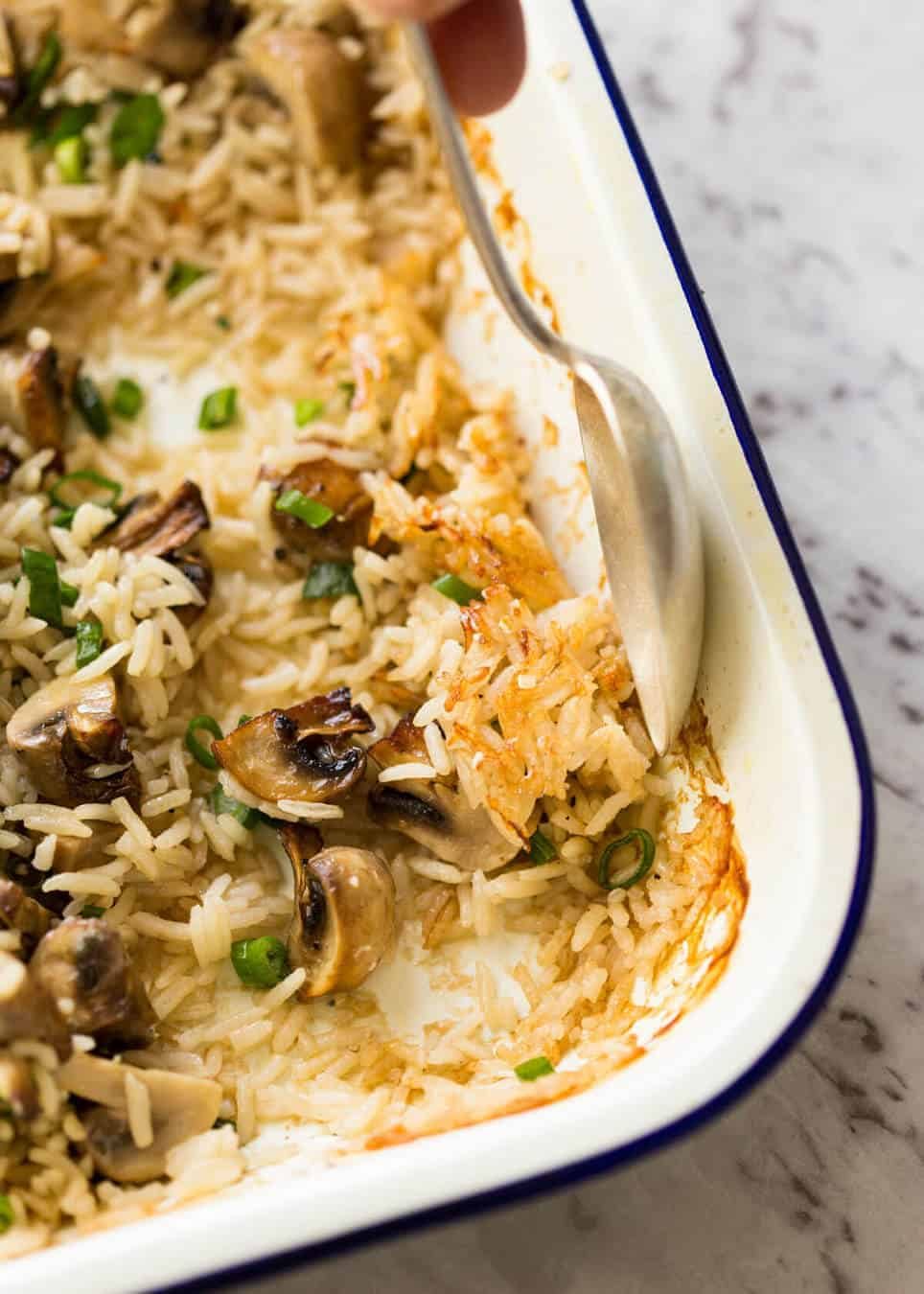 Baked Mushroom Rice - buttery, garlicky, golden brown juicy mushrooms and fluffy rice, all baked in one pan! recipetineats.com