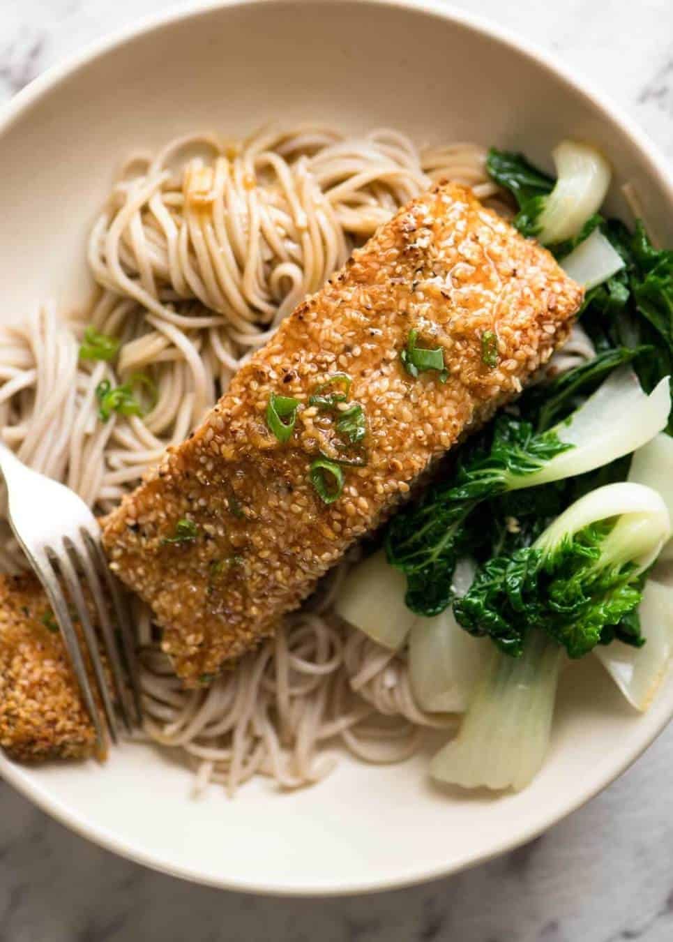 Just roll the salmon in sesame seeds, drizzle with oil and bake! You'll be amazed how well the sesame adheres to the salmon and love how crispy this Sesame Salmon comes out!
