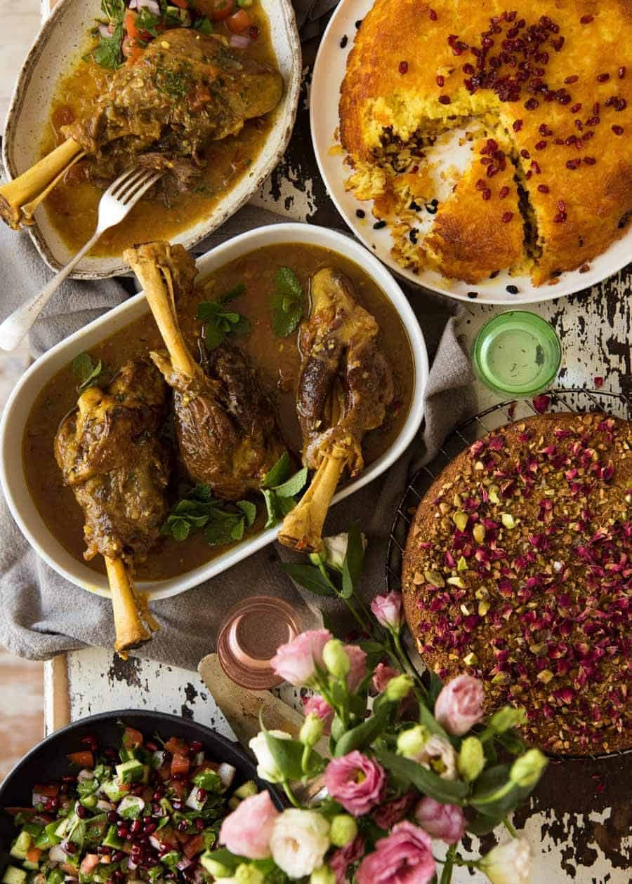 A table filled with Persian dinner recipes for Persian Feast week