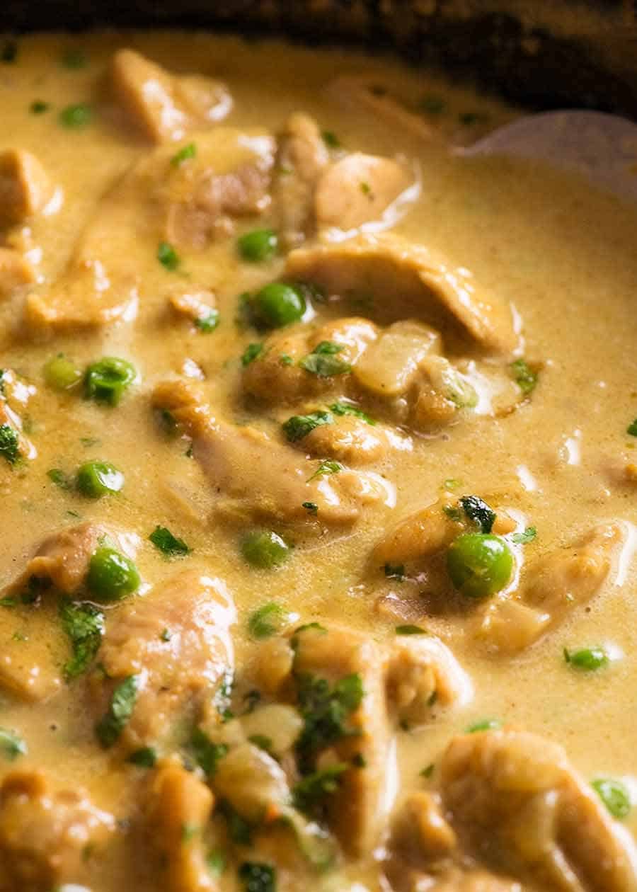 Close up of Chicken Curry in a black skillet, fresh off the stove