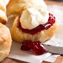 Close up of Lemonade Scones with jam and crean
