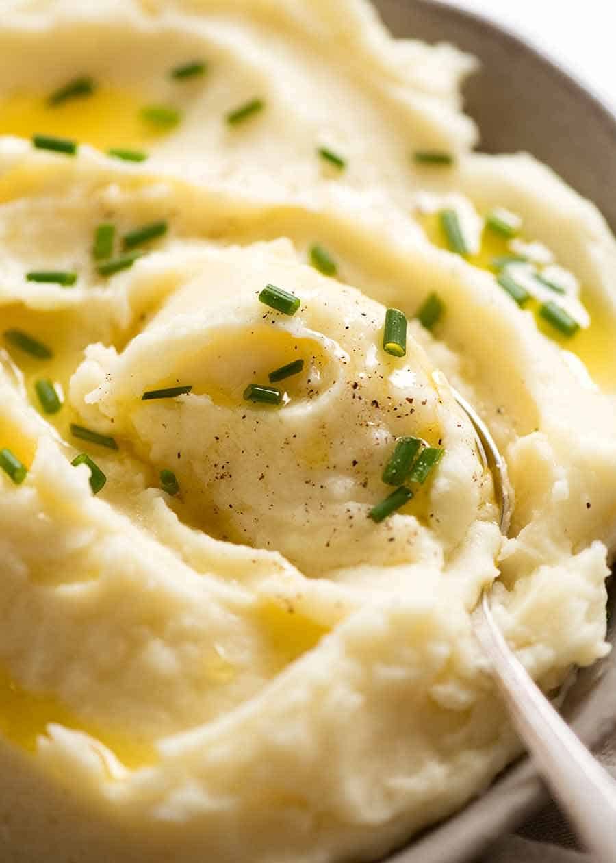 Close up of spoon scooping up Mashed Potato