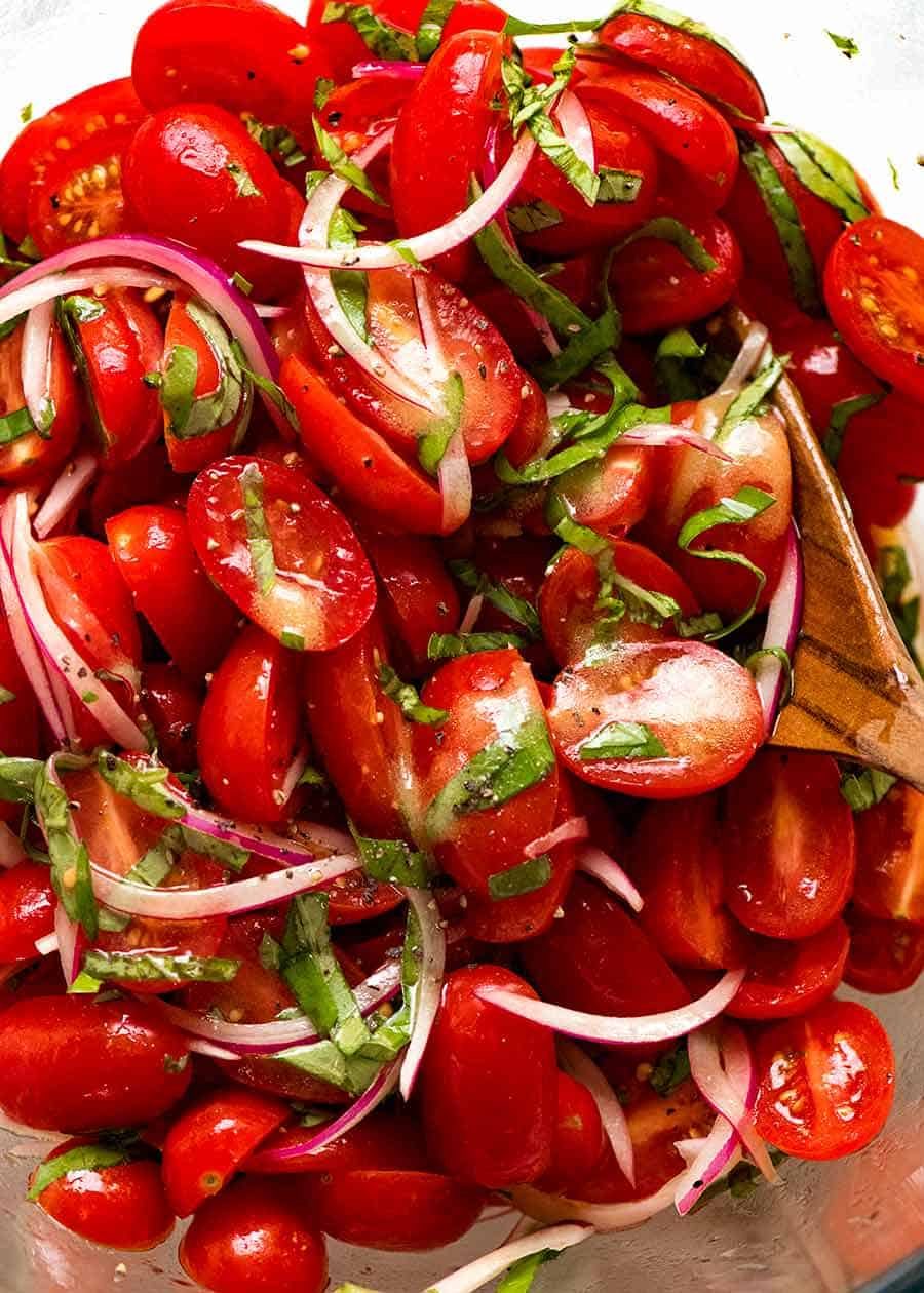 Close up of juicy Tomato Salad with Basil, ready to be served
