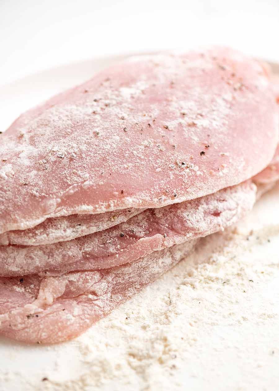 Flour dusted chicken breast ready to be pan fried