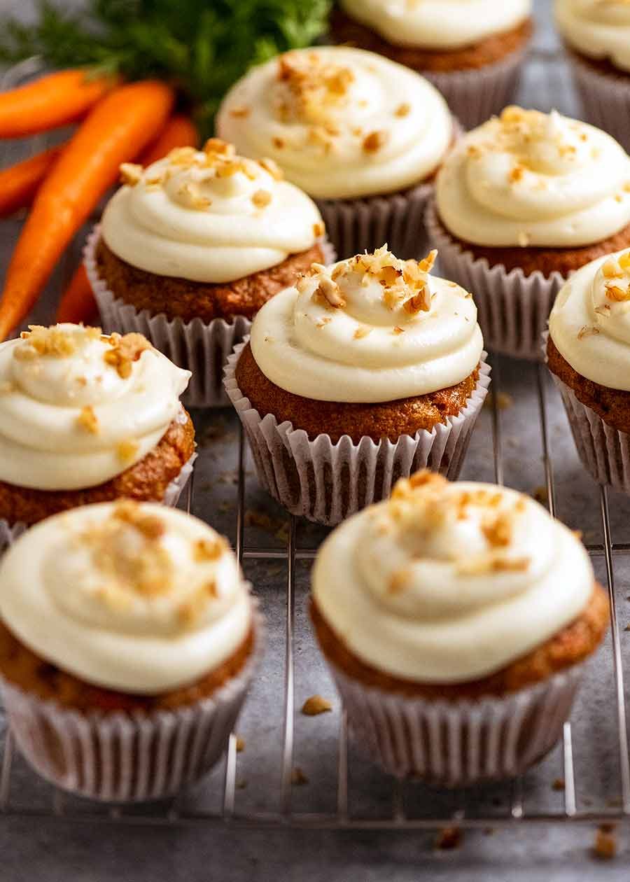 Carrot Cake Cupcakes with Cream Cheese Frosting on a rack, ready to be served